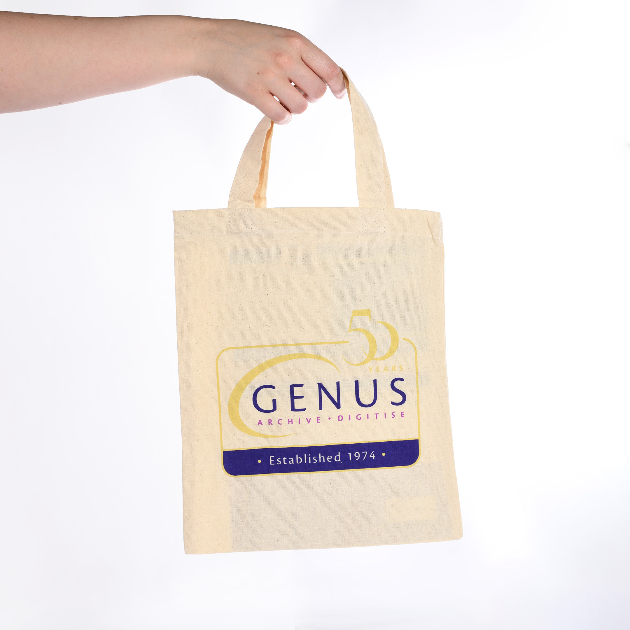 Reusable bag with Genus 50th anniversary branding being held upright. 